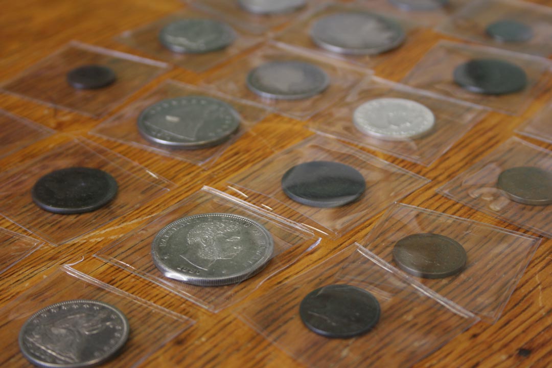 Coins wrapped inside of plastic to avoid corrosion